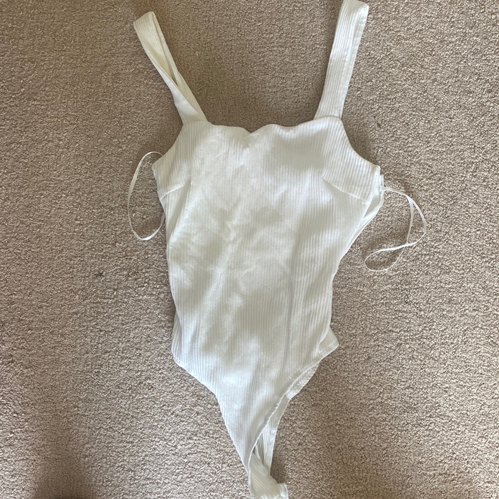 White tank top bodysuit. Size 6. Lightly worn.